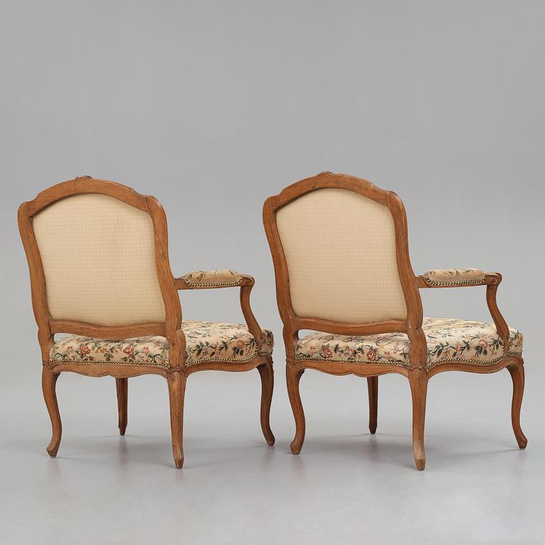 Two matched Louis XV armchairs by Charles Francois Normand (master in Paris 1747), mid 18th century.