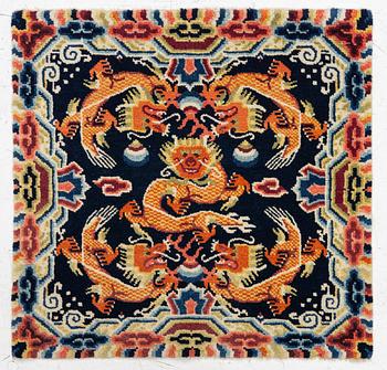 A Chinese small square rug, semi-antique, 65 x 68 cm.