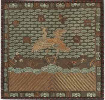 An embroidered civil official's rank badge with a bird, 'buzi', Qing dynasty.