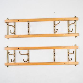 A pair of 'Dekorativ' coat hangers, Skoglunds metallgjuteri, Anderstorp, mid 20th Century.