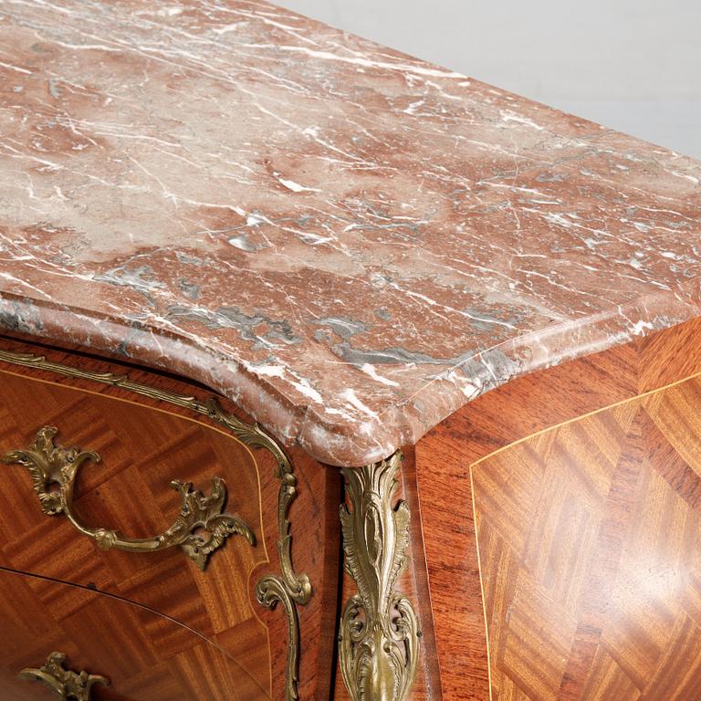 A pair of rococo style chest of drawers, mid 20th Century.