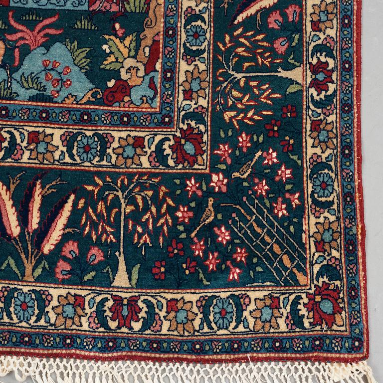 A rug, a semi-antique Esfahan figural part silk, ca 222-227,5 x 128-135,5 cm.