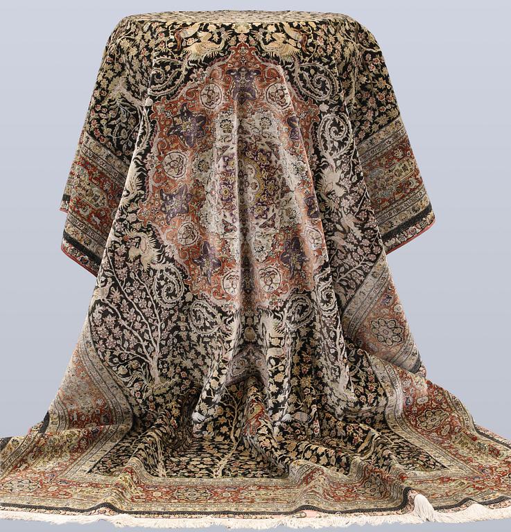 A oriental silk carpet, 303 x 201 cm.