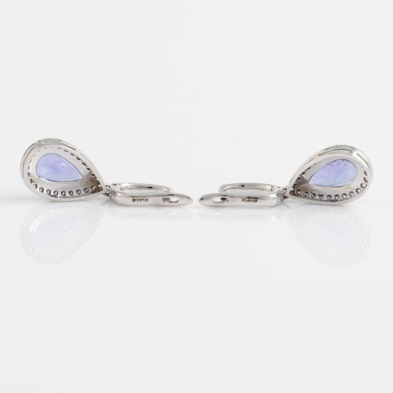 Pear shaped tanzanite and brilliant cut diamond earrings.