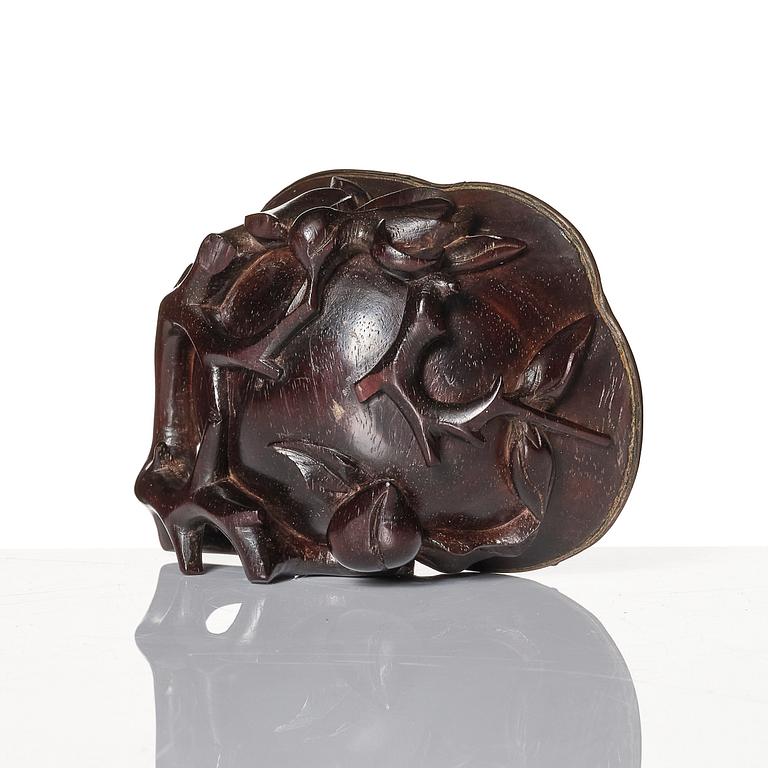 A sculptured wooden cup with silvered liner, Qing dynasty.