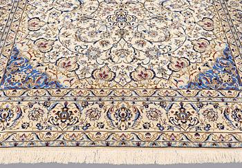 A carpet, Nain part silk, 364 x 256 cm.