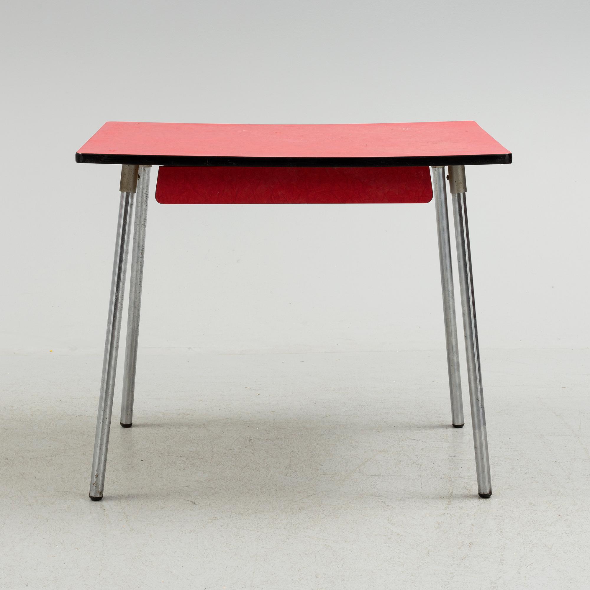A mid 20th century table and chair.