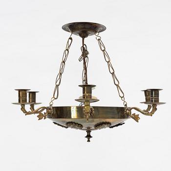 An empire style brass chandelier, around 1900.