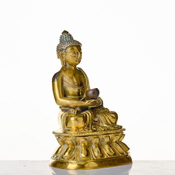 A seated bronze figure of amithaba buddha, Tibeto-chinese, 18th Century.