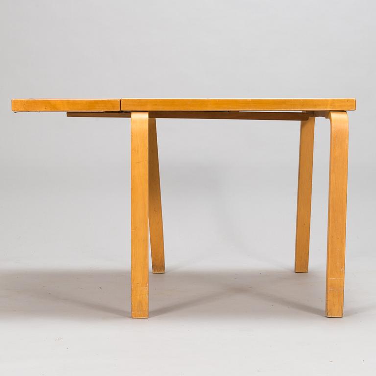 Alvar Aalto, a mid 20th century 'DL85' folding table, seven chairs for Artek.