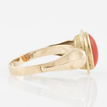 Ring of low carat gold with coral.