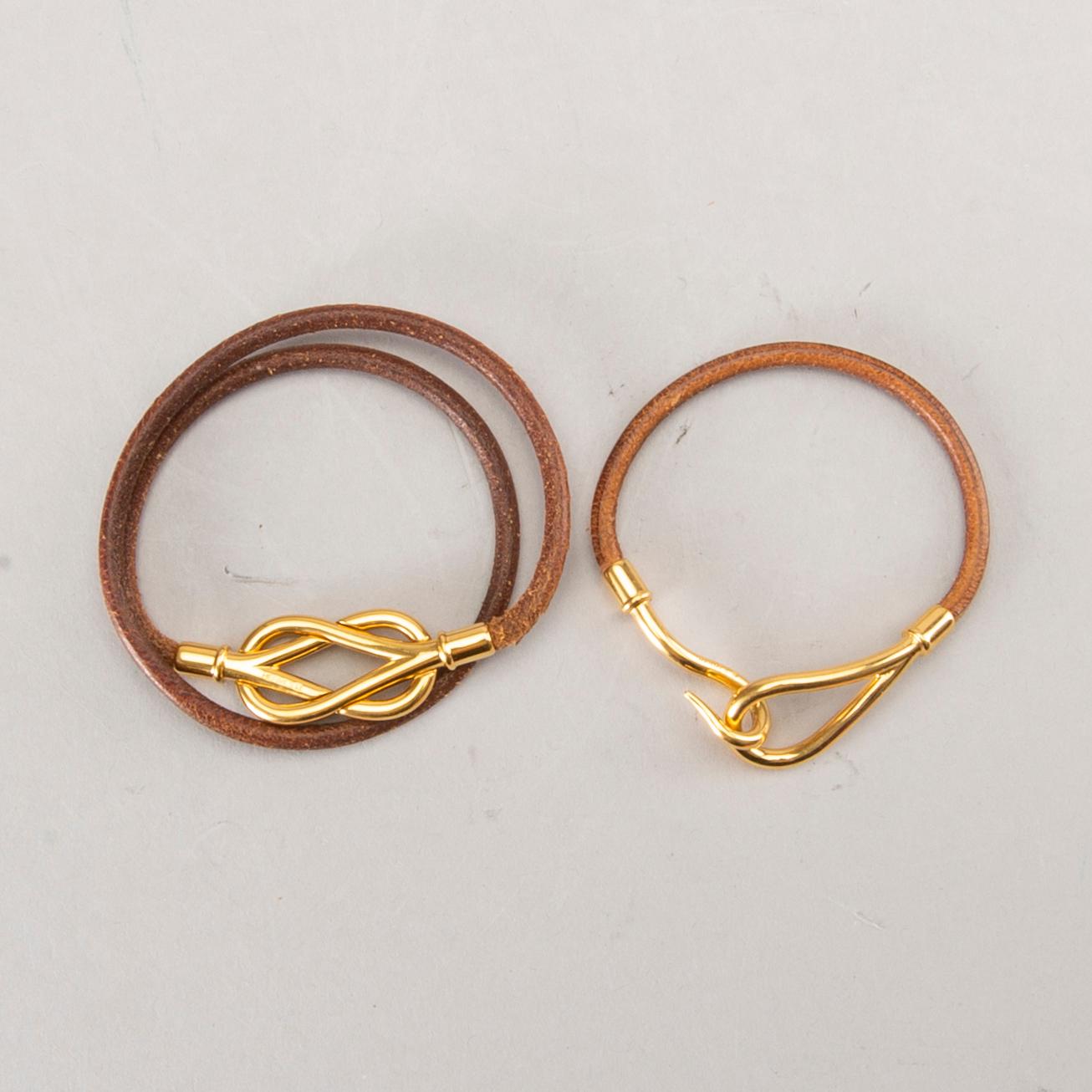 Two Hermès braclets.