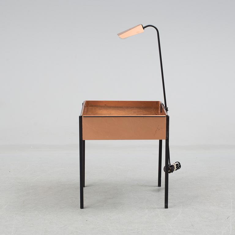 a flower table with a light by Gnosjö konstsmide in the second half of the 20th century.