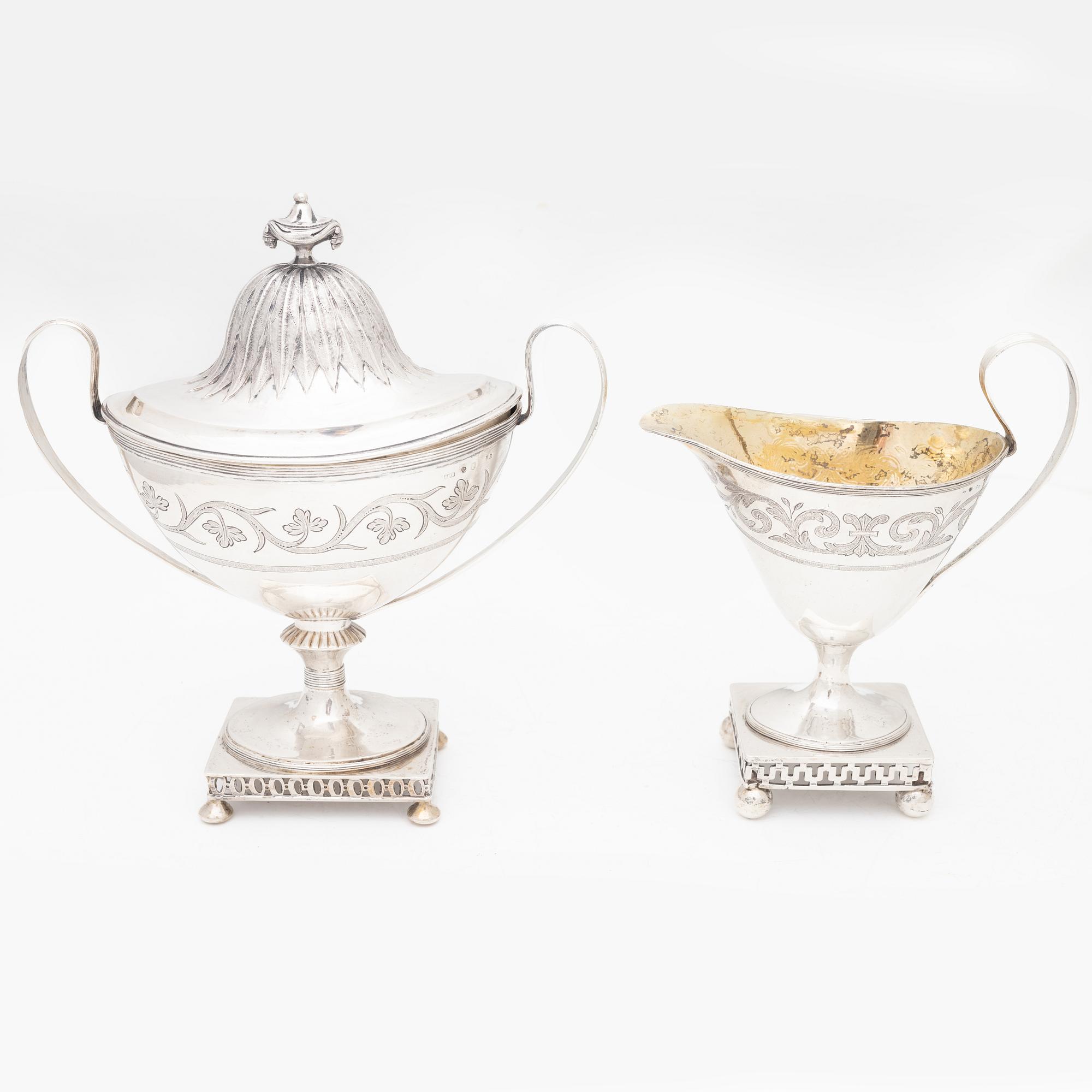A silver sugarbowl with lid and a creamer, marks of Olof Hellbom, Stockholm, Sweden 1799-1800.