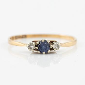 Ring, 18K gold with a small sapphire and octagon-cut diamonds.