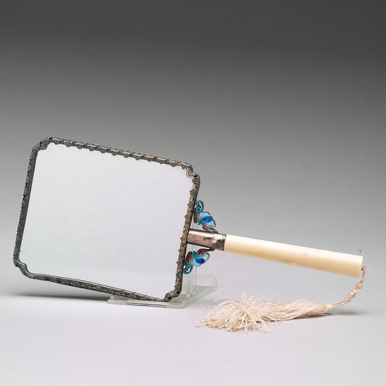 A Chinese enameled silver mirror with a large carved nephrite placque, early 20th Century.