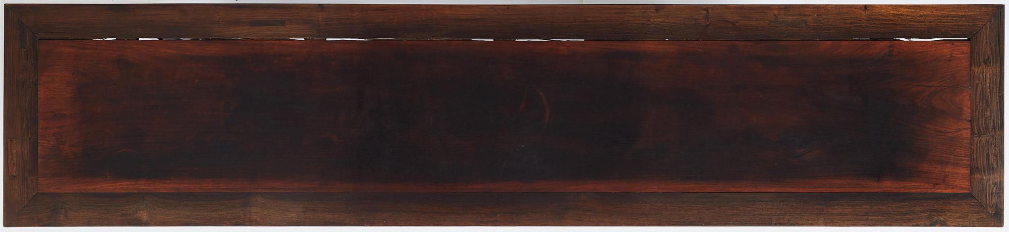 A massive zitan recessed-leg long table 'Jiaotousun Qiotouan', Qing dynasty, 19th century.