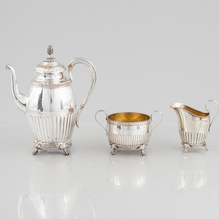 A Swedish Silver Coffee Pot, Creamer and Sugar Bowl, mark of GAB, Stockholm 1910-11.