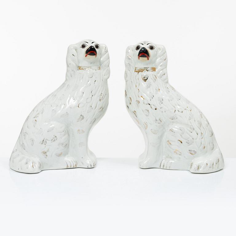 A pair of creamware glass-eyed Spaniels, Staffordshire, England, Victorian (1837-1901).
