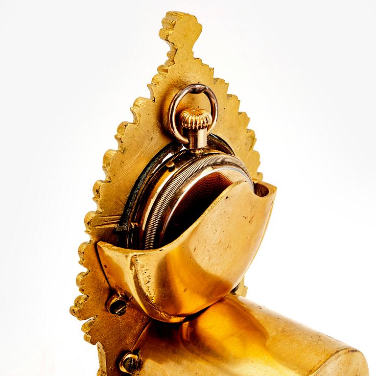 A mid 1800s gilded bronze pocket watch stand and pocket watch.