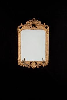 A pair of Swedish Rococo 18th century two-light girandole mirrors.