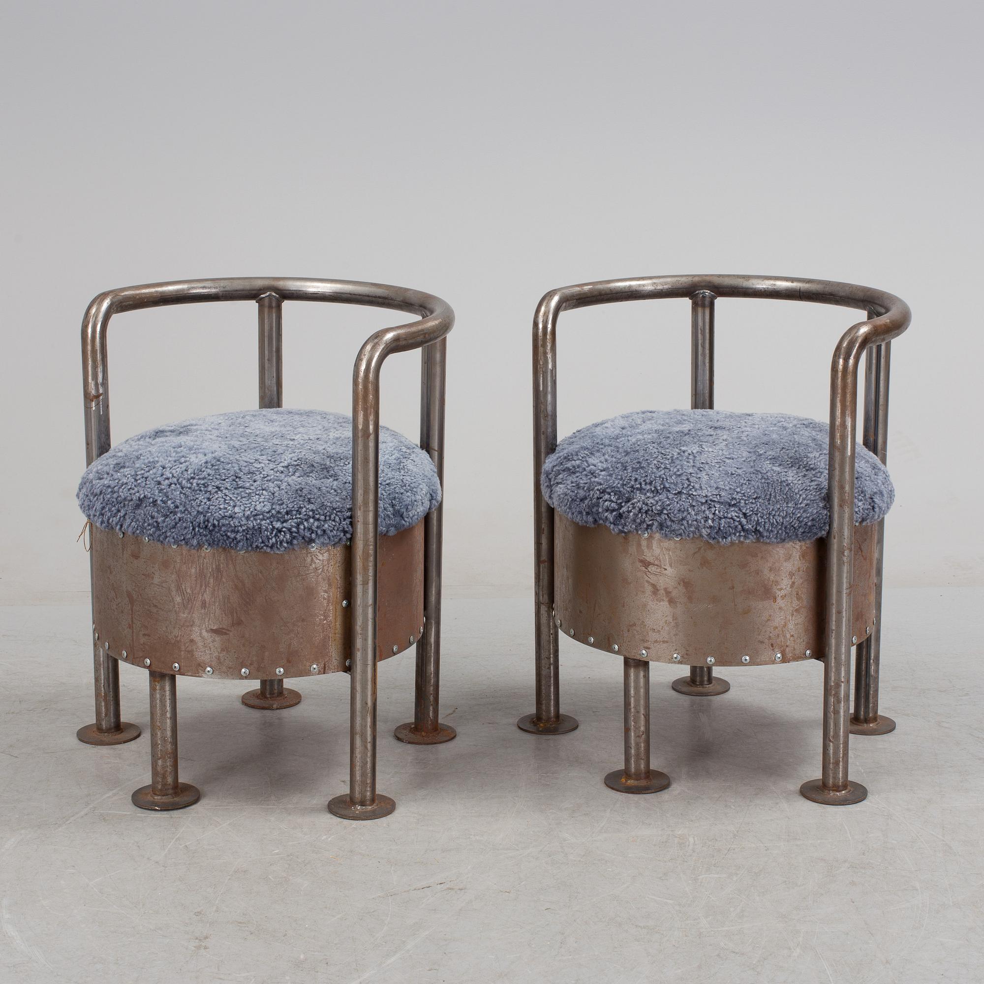 A pair of steel chairs by Arpad Földessy, 21st Century.