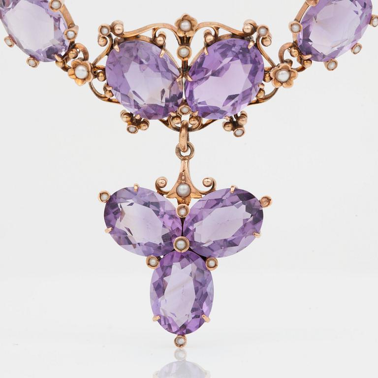 An amethyst and seed pearl necklace. French hallmarks.