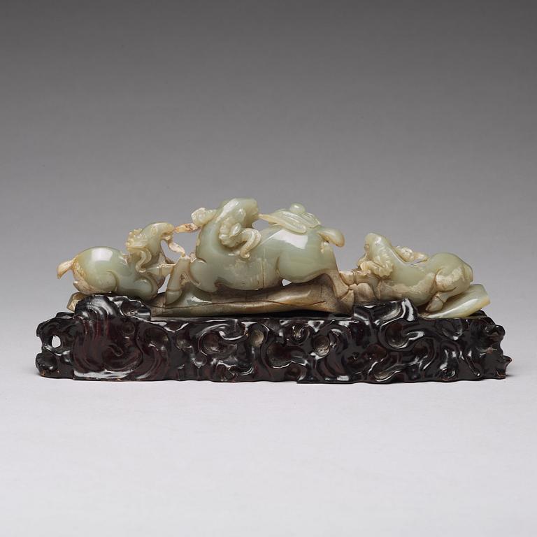 A Chinese nephrite sculpture of three rams.