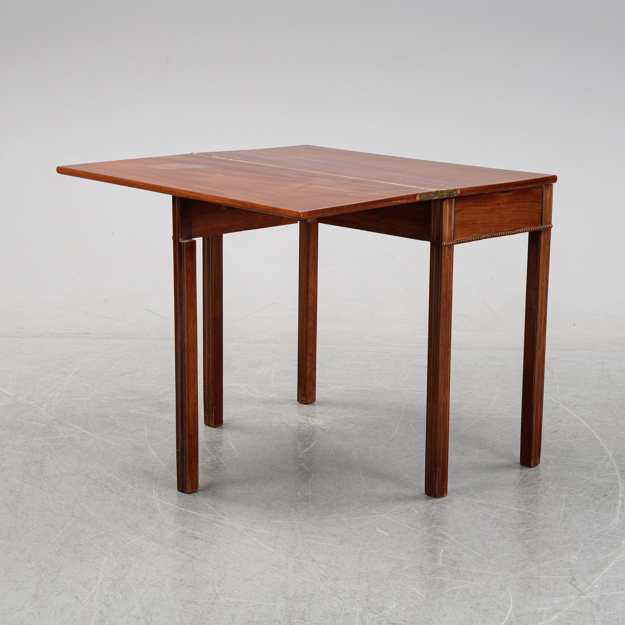 A mahogany games table, circa 1800.