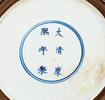 A large blue and white charger, Qing dynasty, with Kangxis six character mark and period (1662-1722).