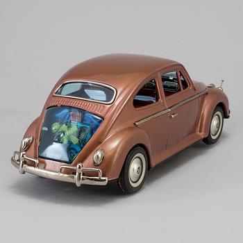 A tinplate Volkswagen sedan by Bandai, Japan, 1960s.