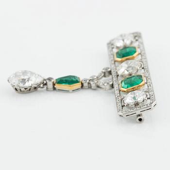 An impressive platinum, step-cut emerald and old-cut diamond brooch by W.A. Bolin likely Moscow 1912-1917. No hallmarks.
