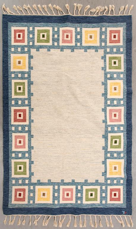 A Swedish flat weave carpet signed Erik Lundberg 245x168 cm.