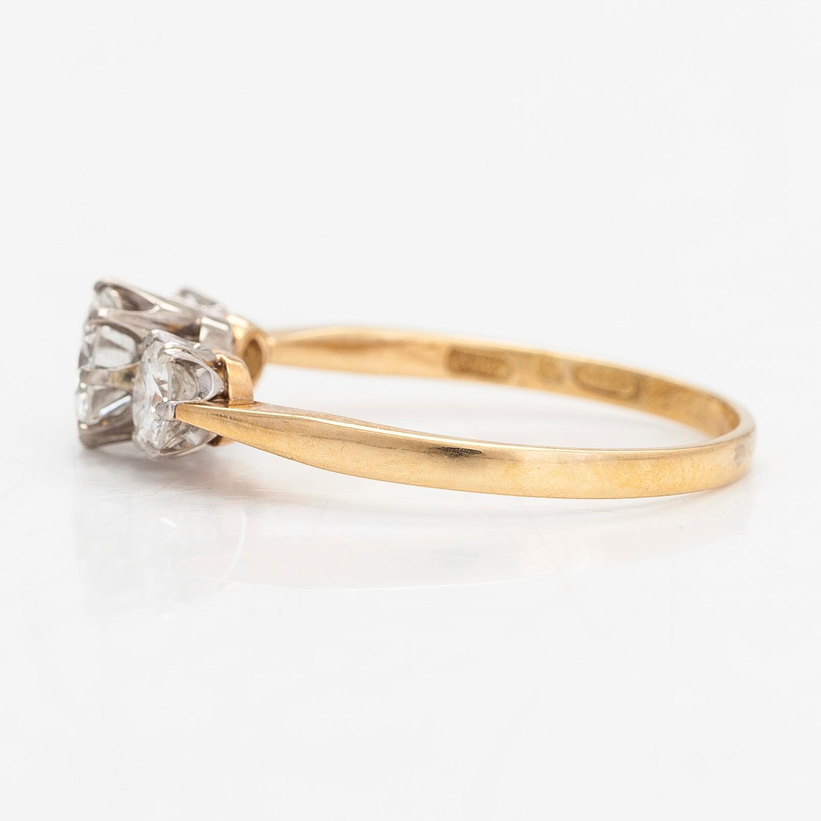 An 18K gold three-stone ring, with brilliant-cut diamonds totalling approximately 1.10 ct. W.Pettersson, Turku.