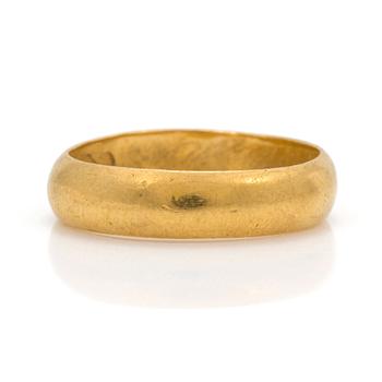 A 23K gold ring.