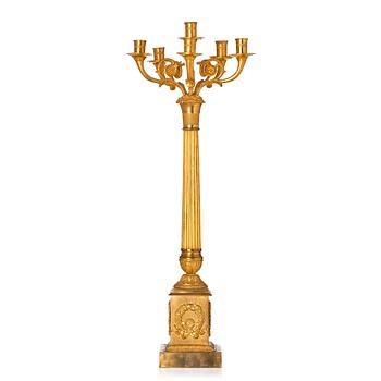 105. A French late Empire gilded six-light candelabra, mid 19th century.