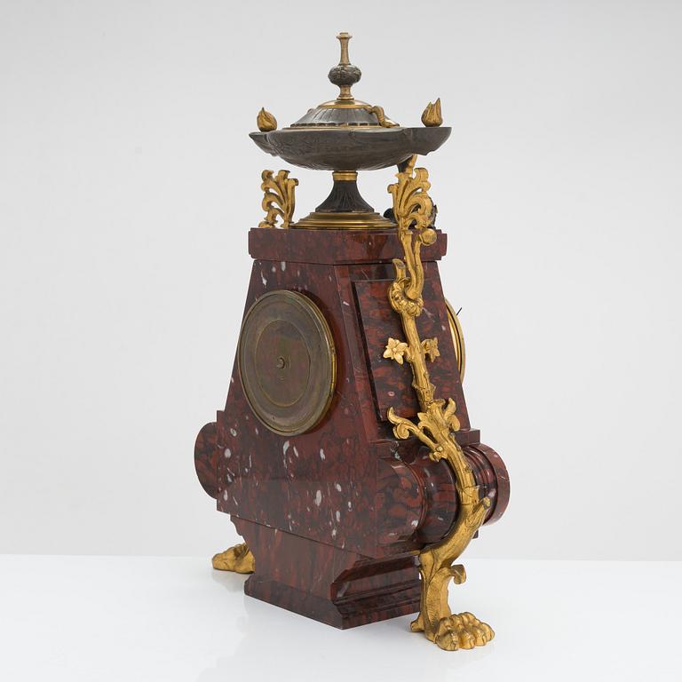 A French mantel clock and pair of candelabra from the last quarter of the 19th century.