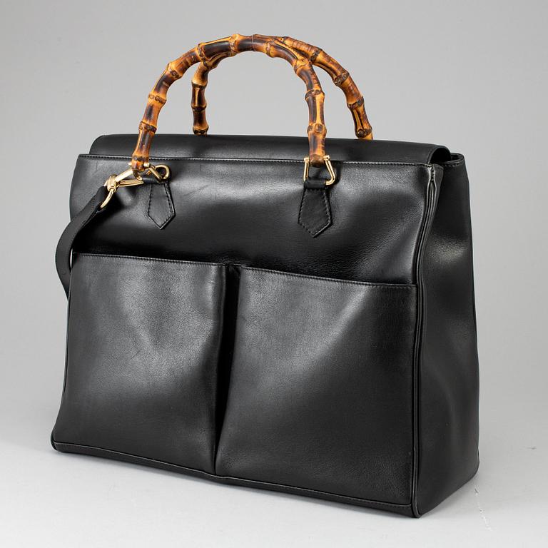 GUCCI, a leather bag/briefcase.