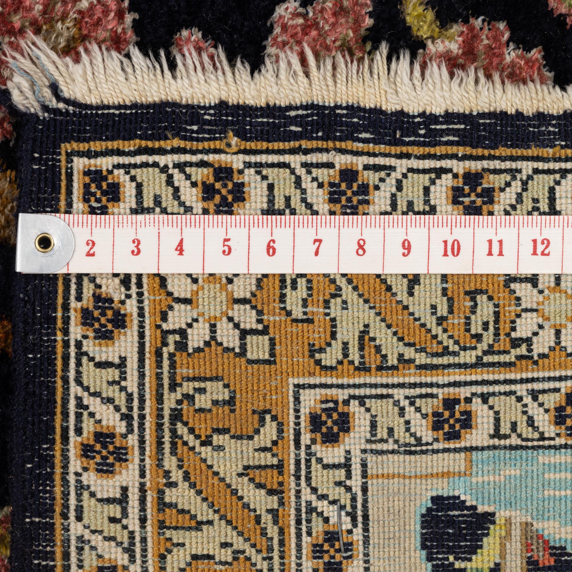 A semi-antique silk Ghom rug, central Iran, c. 32 x 23 in.