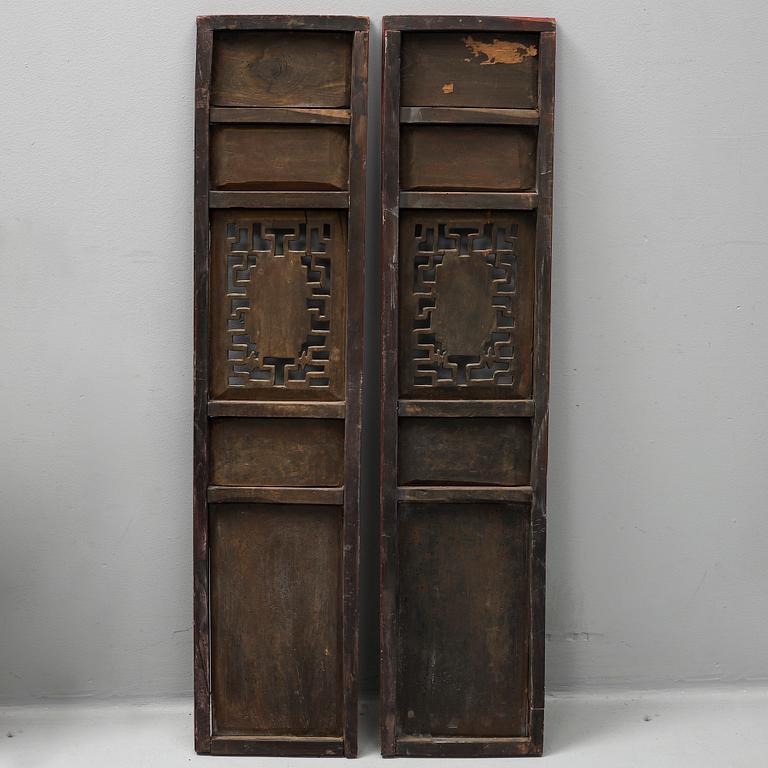 A pair of Chinese red lacquered wooden panels, 20th century.