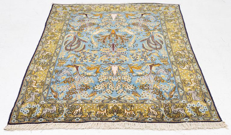 A Ghom figural rug, c. 202 x 132 cm.