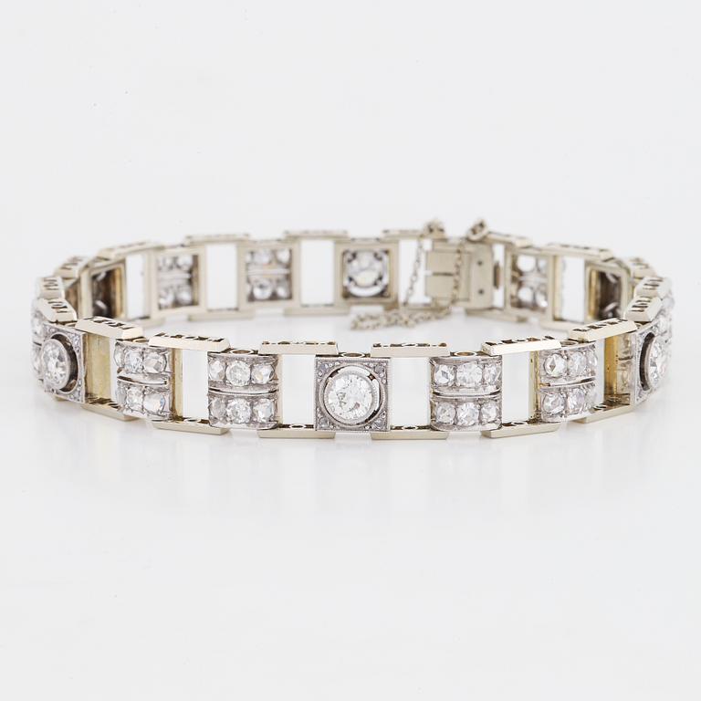 An 18K white gold bracelet set with old- and rose-cut diamonds.