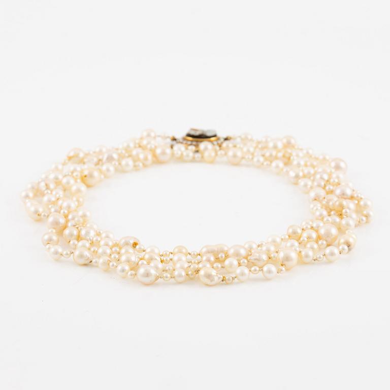 Necklace of two strands of cultured pearls, clasp 18K gold with a hardstone cameo.