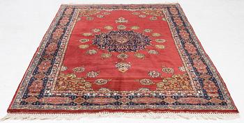 An oriental rug, c. 245 x 150 cm.