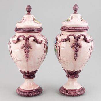 A pair of earthenware vases with covers, early 20th century.