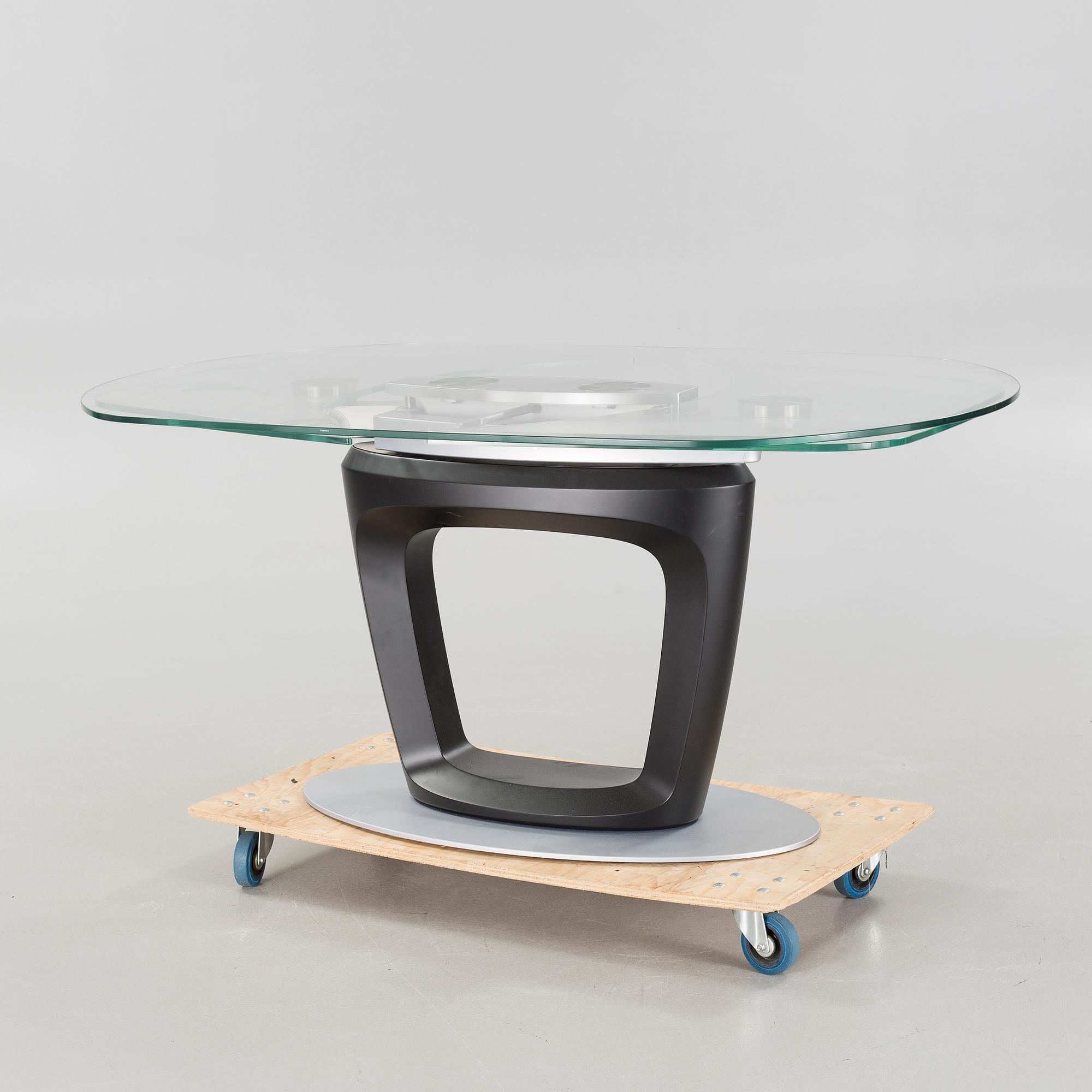 A 21st century "Orbital" dinner table by Pininfarina for Calligaris.