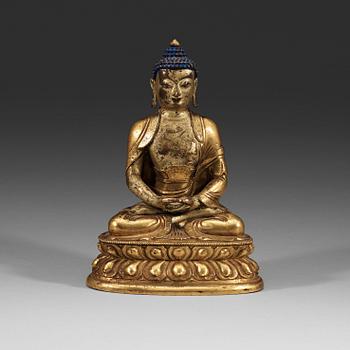 214. A seated Sino-Tibetan part gilt bronze figure of Amithaba Buddha, 18th Century.
