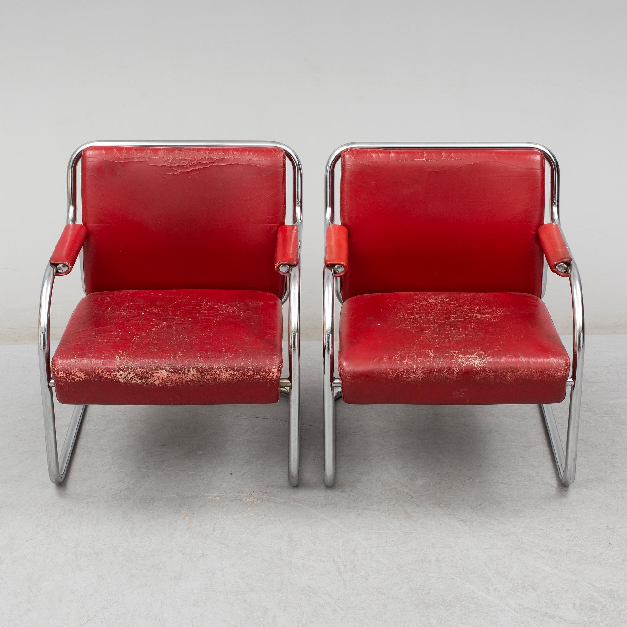 A pair of 1920s armchairs.