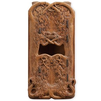 127. An Art Nouveau corner cabinet, carved birch, Sweden, early 1900s.