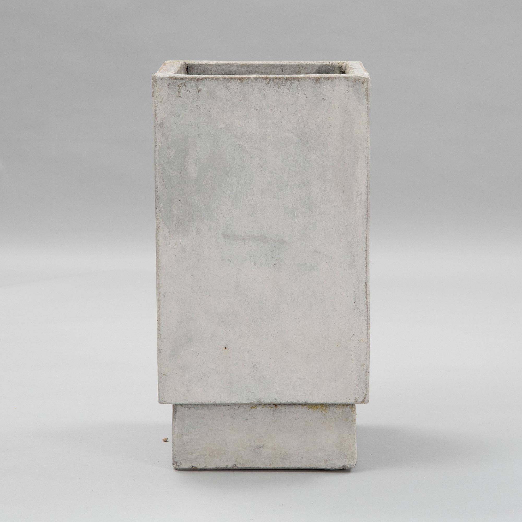 A contemporary concrete flowerpot.